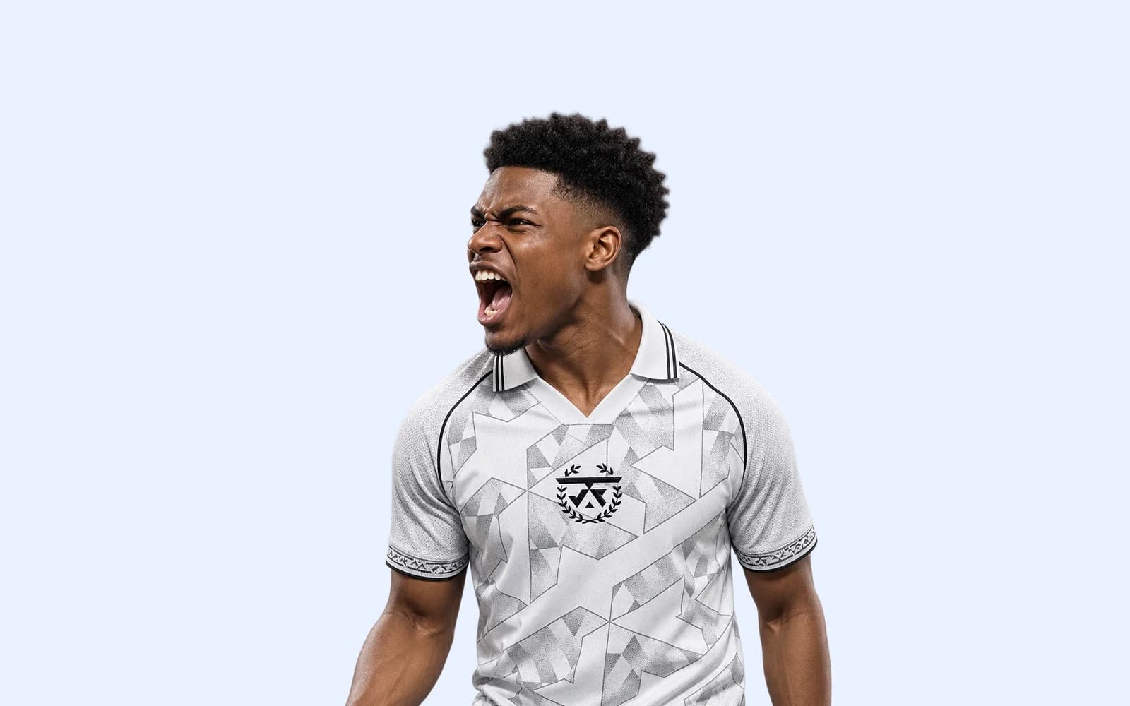 Close-up of the crest and geometric artwork on the white JFT jersey